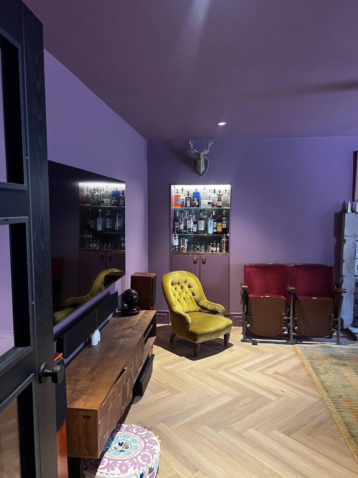 Snug with lined walls and ceiling painted in a deep violet, with matching built-in cabinets, Grove Street, Edinburgh
